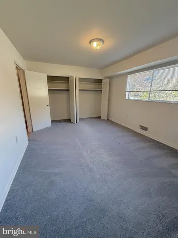 a view of balcony with wooden floor and fence
