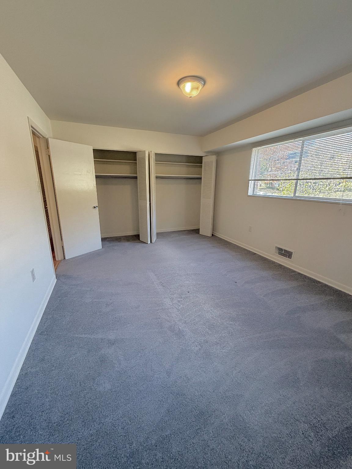 10661 Weymouth Street, Unit 101 Bethesda, MD 20814 - Photo 15 of 23 an empty room with a fireplace and cabinet
