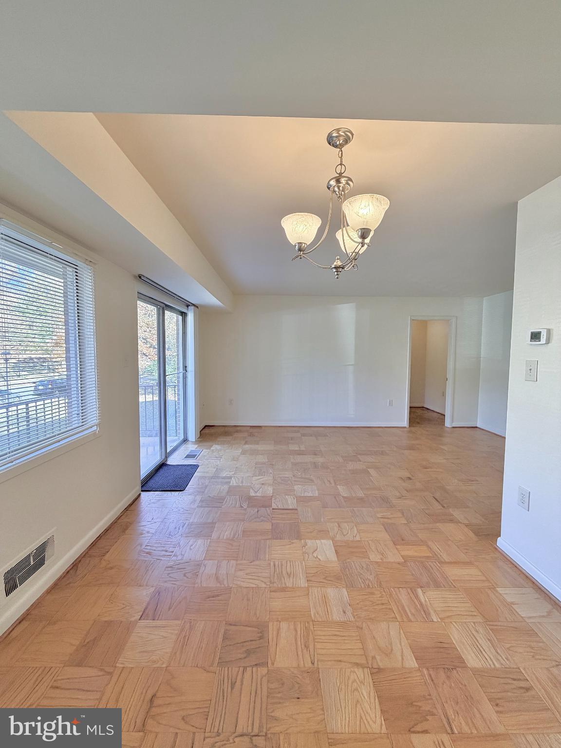10661 Weymouth Street, Unit 101 Bethesda, MD 20814 - Photo 20 of 23 a view of an empty room with a window
