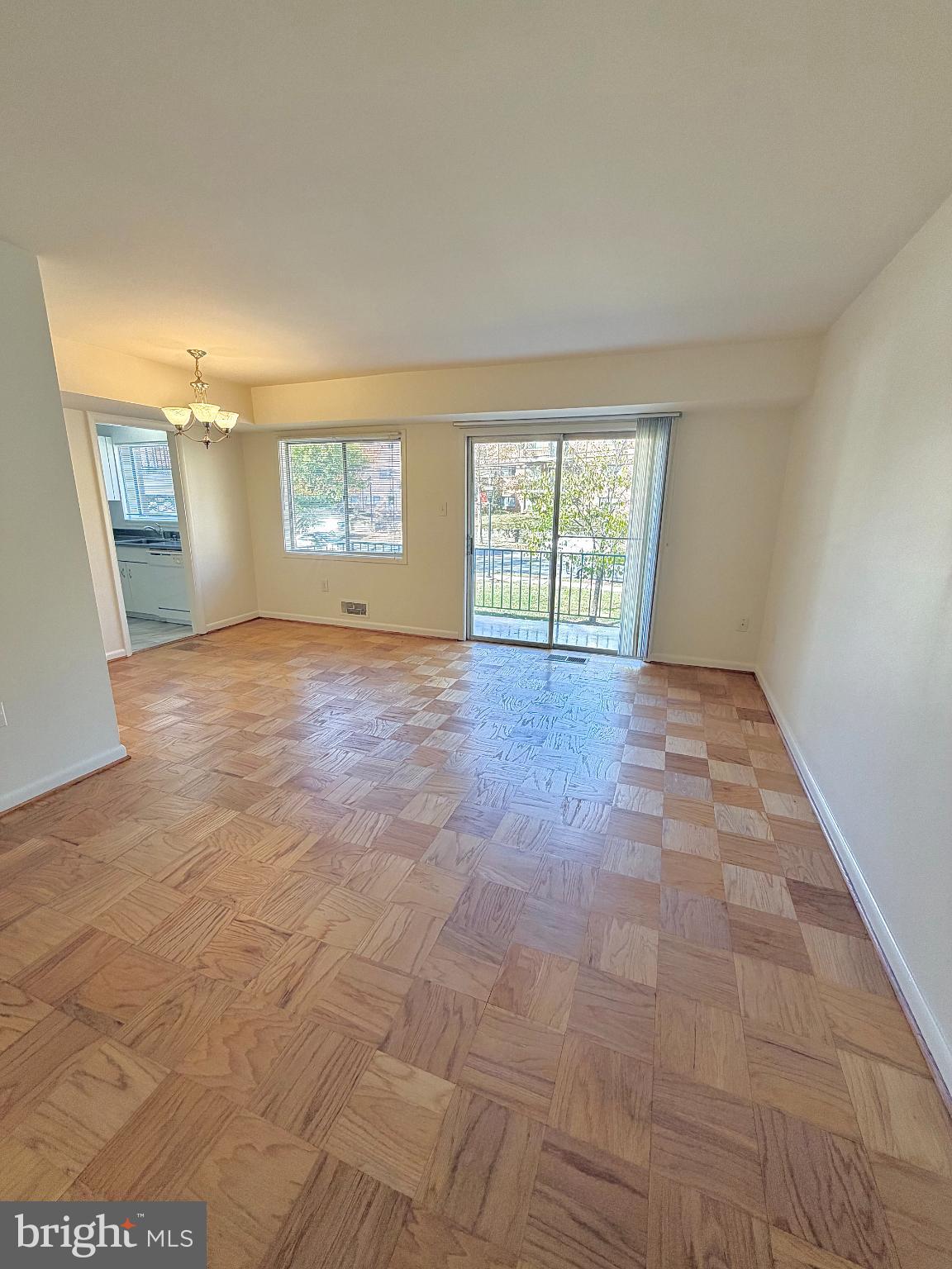 10661 Weymouth Street, Unit 101 Bethesda, MD 20814 - Photo 7 of 23 an empty room with windows