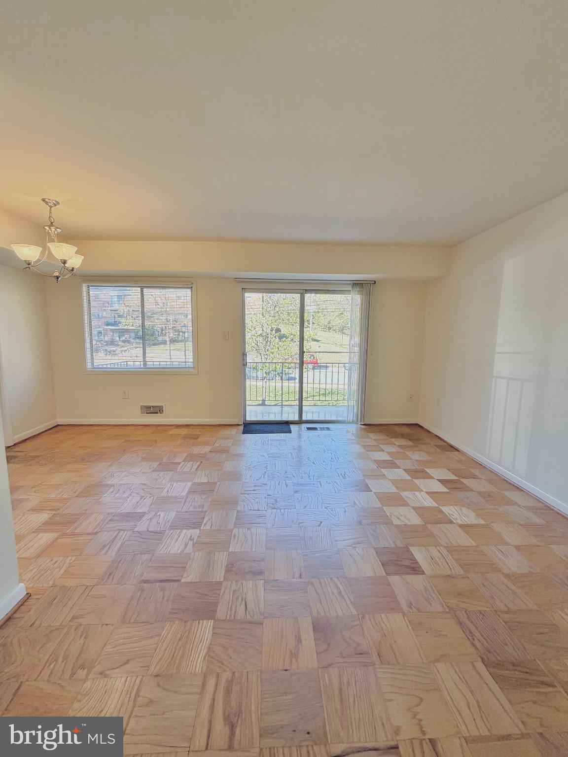 10661 Weymouth Street, Unit 101 Bethesda, MD 20814 - Photo 8 of 23 a view of an empty room with a window