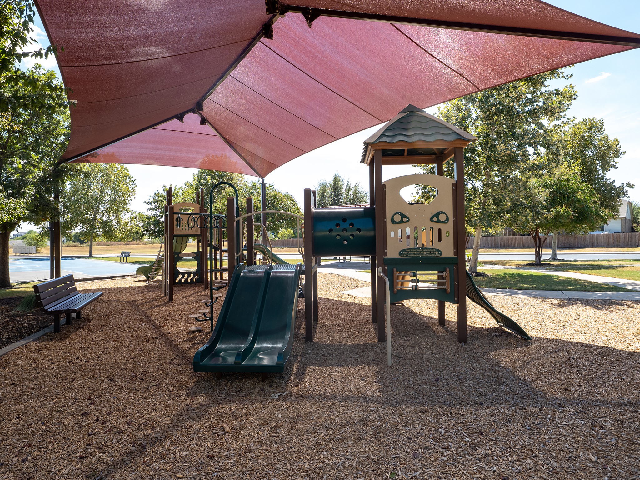 104 Rocroi Drive Georgetown, TX 78626 - Photo 37 of 40 Shade sails cover the extensive playground area surrounded by mature trees.