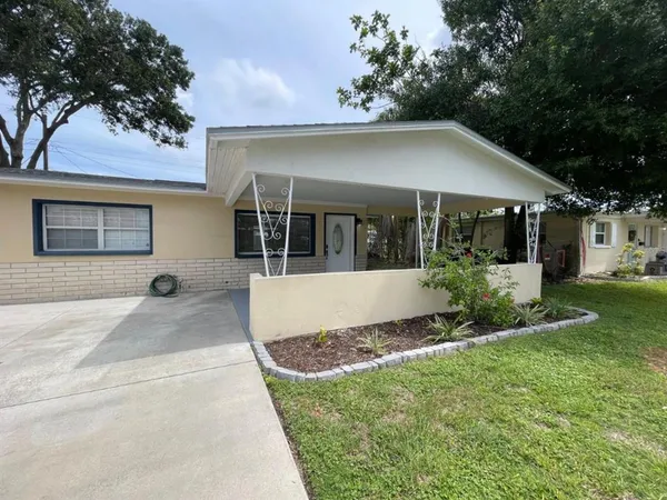 front view of a house with a yard