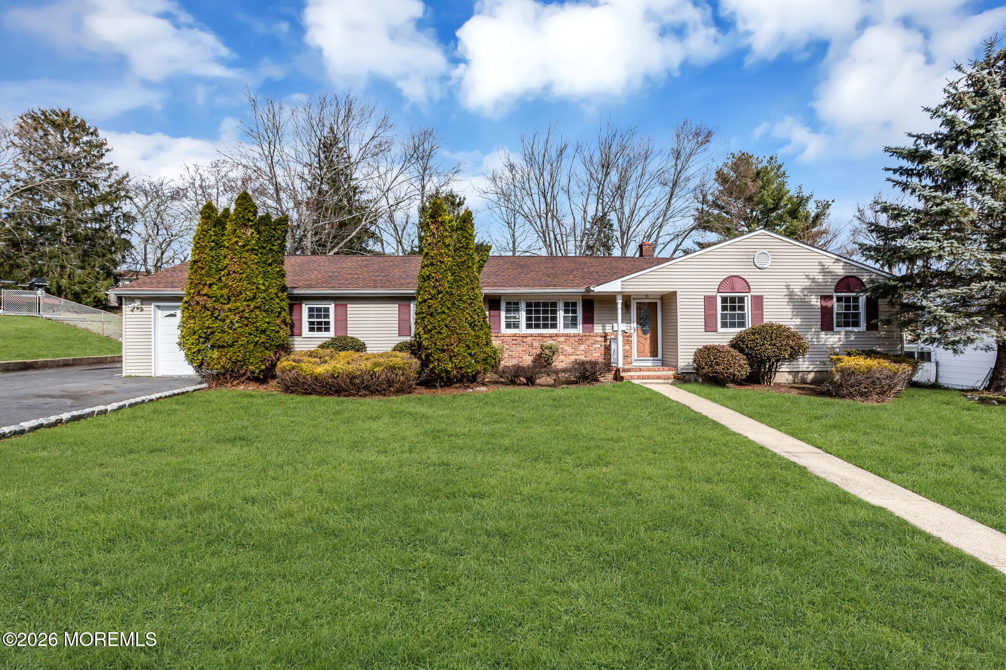 50 Westbrook Road Howell, NJ 07731 - Photo 2 of 73 a front view of a house with a garden