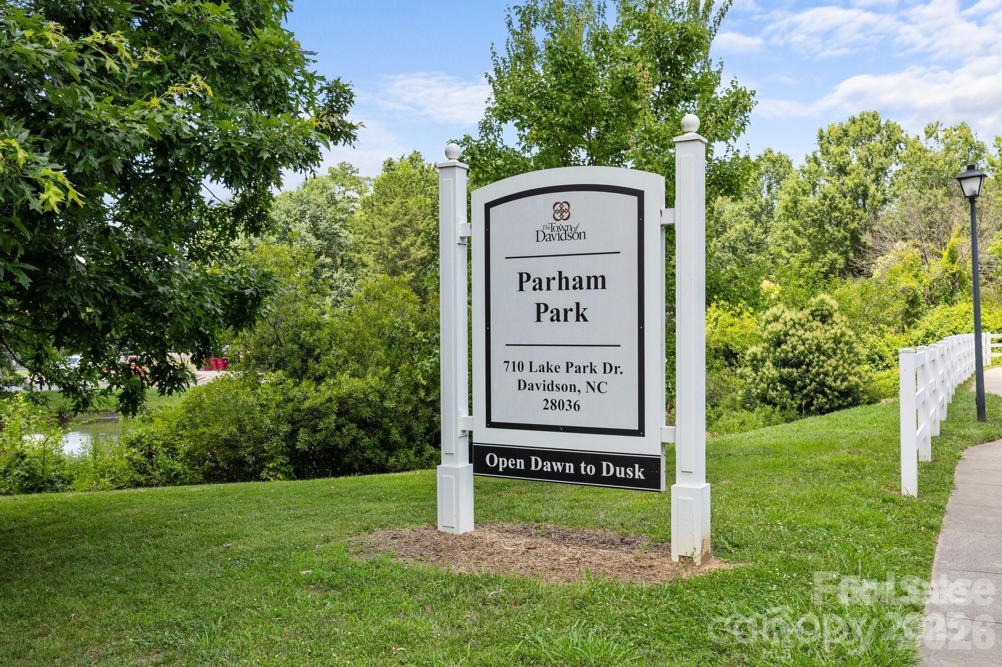 249 Faust Road Davidson, NC 28036 - Photo 18 of 21 a sign that is sitting in front of a tree