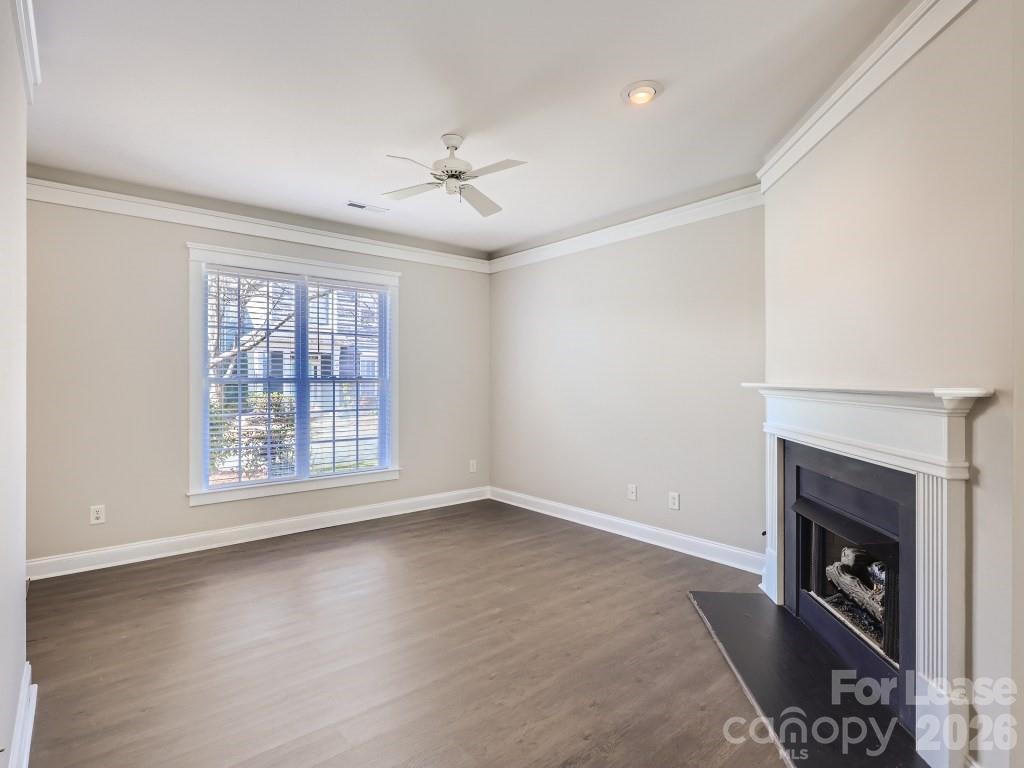 249 Faust Road Davidson, NC 28036 - Photo 2 of 21 an empty room with windows and fireplace