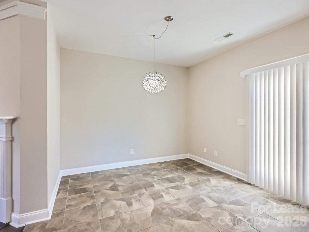 249 Faust Road Davidson, NC 28036 - Photo 5 of 21 a view of empty room with window