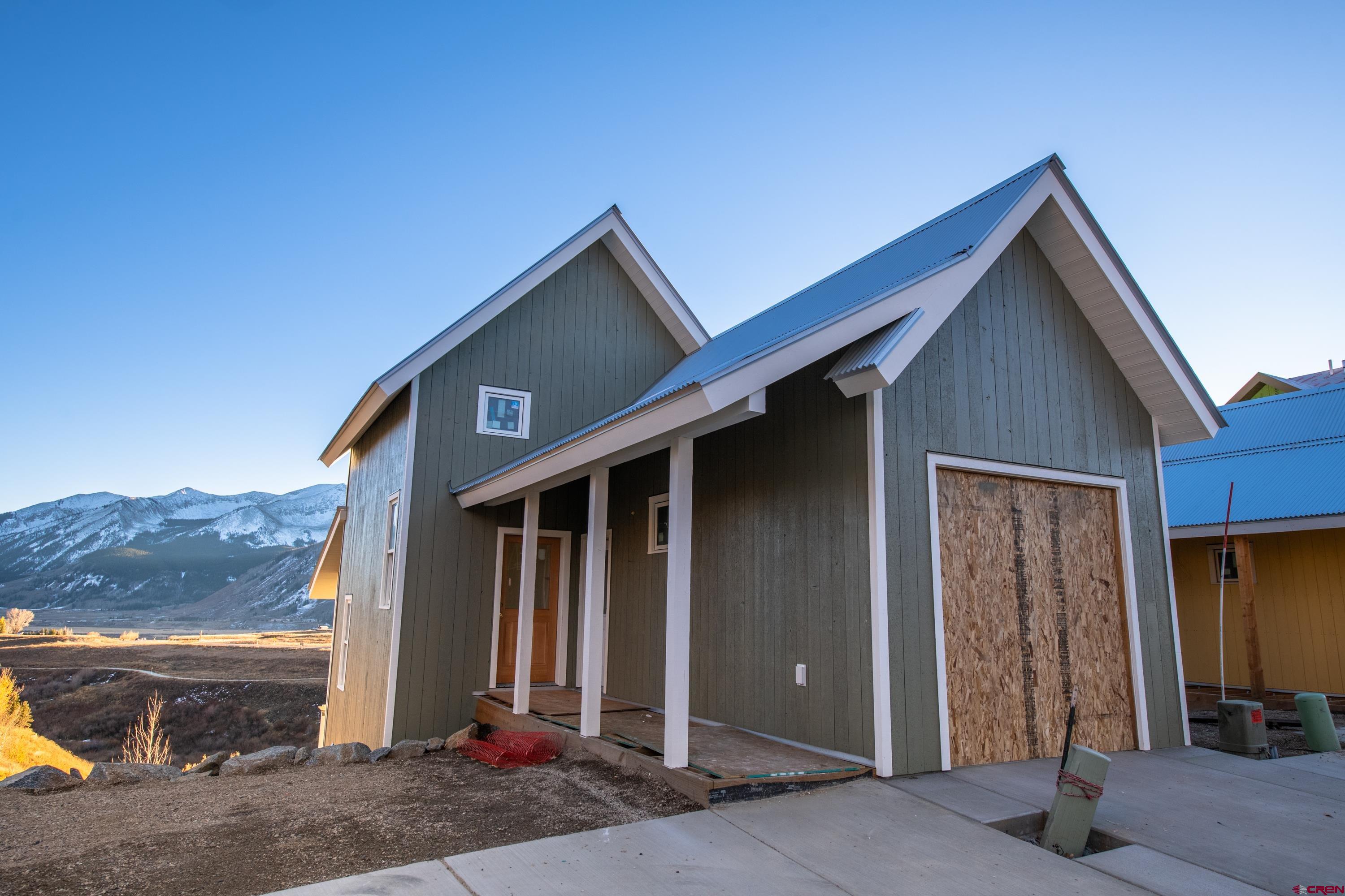 320 Horseshoe Crested Butte, CO 81225 - Photo 1 of 34 a front view of a house with parking