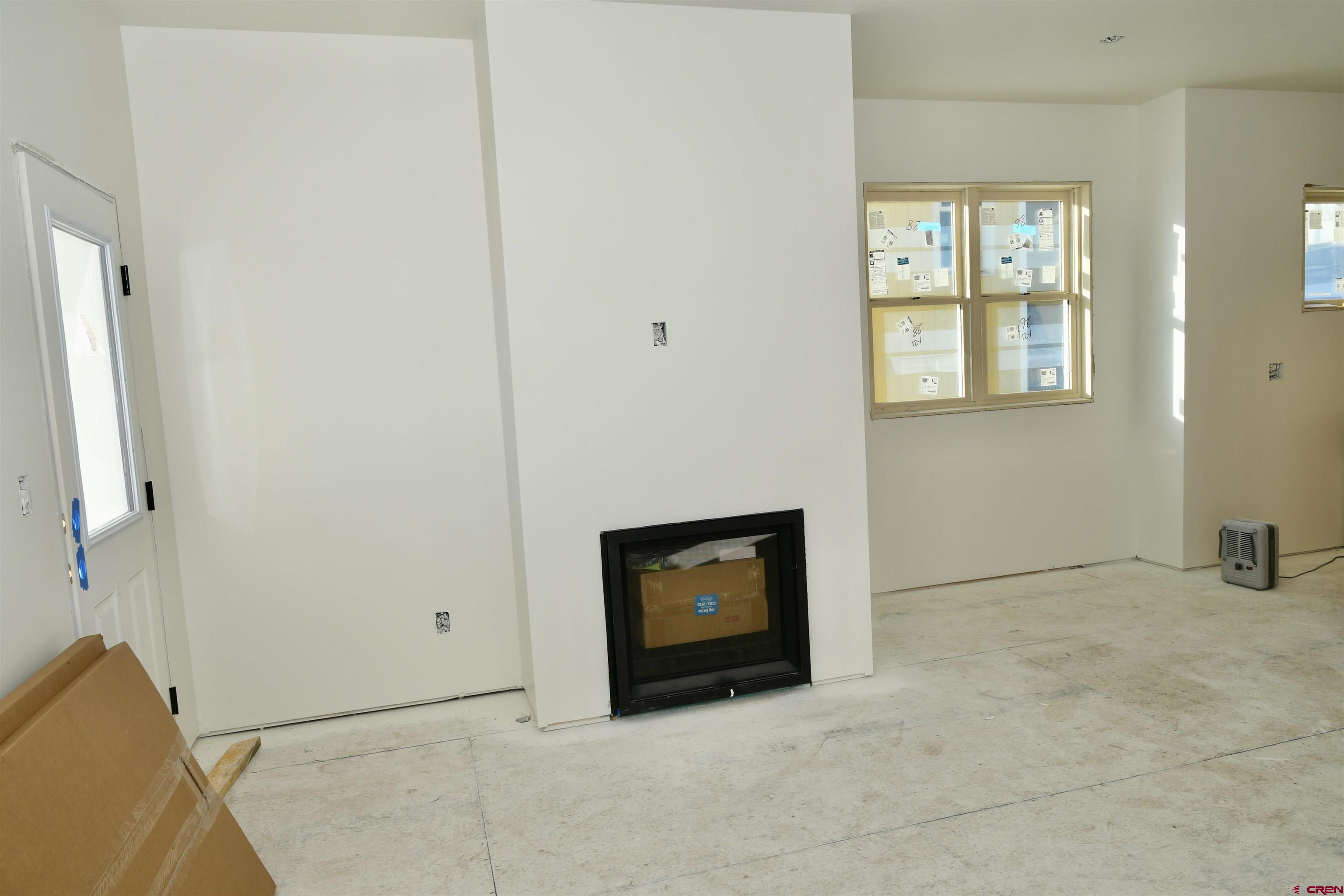 320 Horseshoe Crested Butte, CO 81225 - Photo 31 of 34 an empty room with windows and fireplace