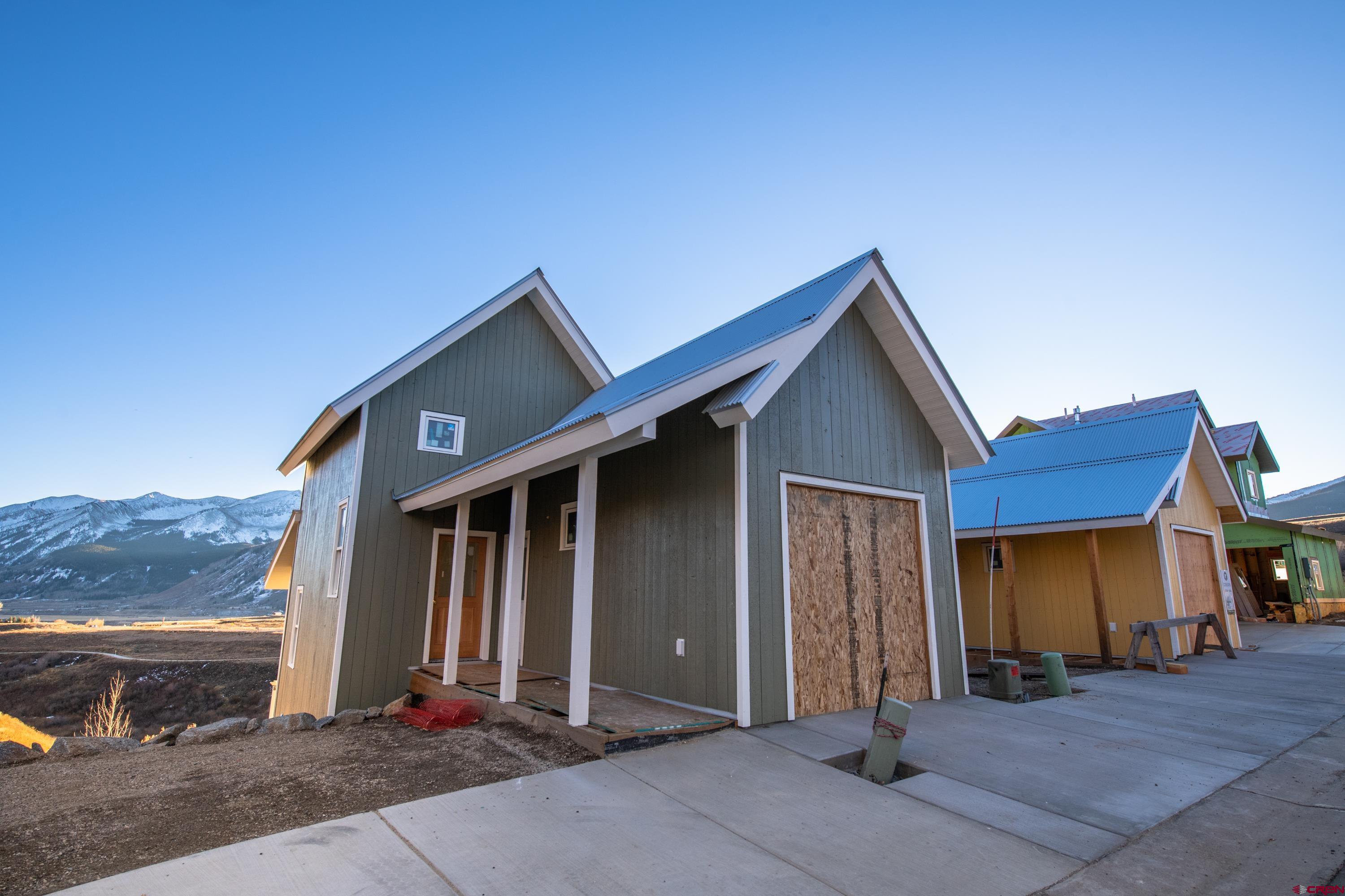320 Horseshoe Crested Butte, CO 81225 - Photo 9 of 34 a front view of a house with basket ball court and garage