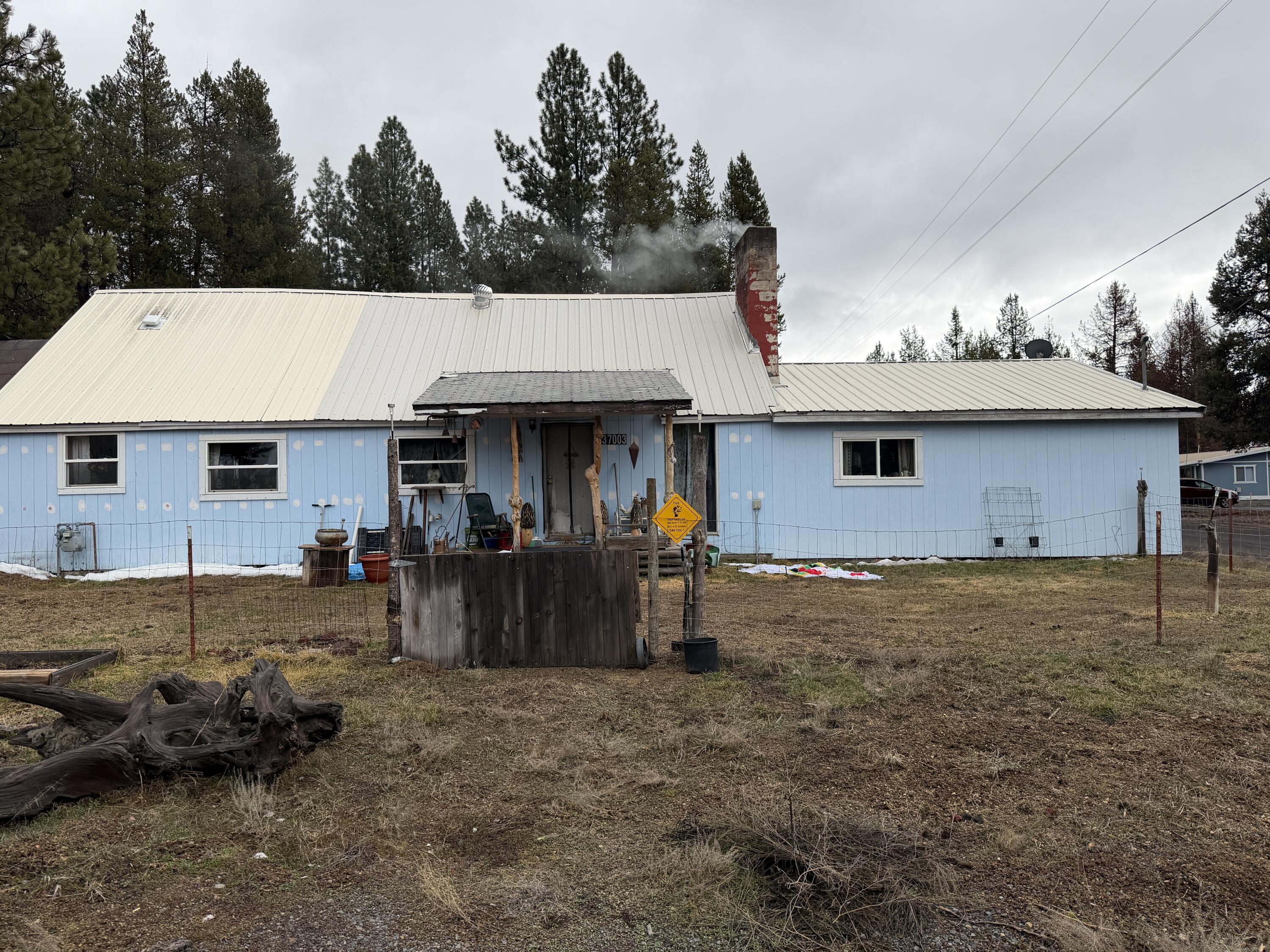 137003 Main Street Crescent, OR 97733 - Photo 2 of 19 a view of a house with backyard and trees
