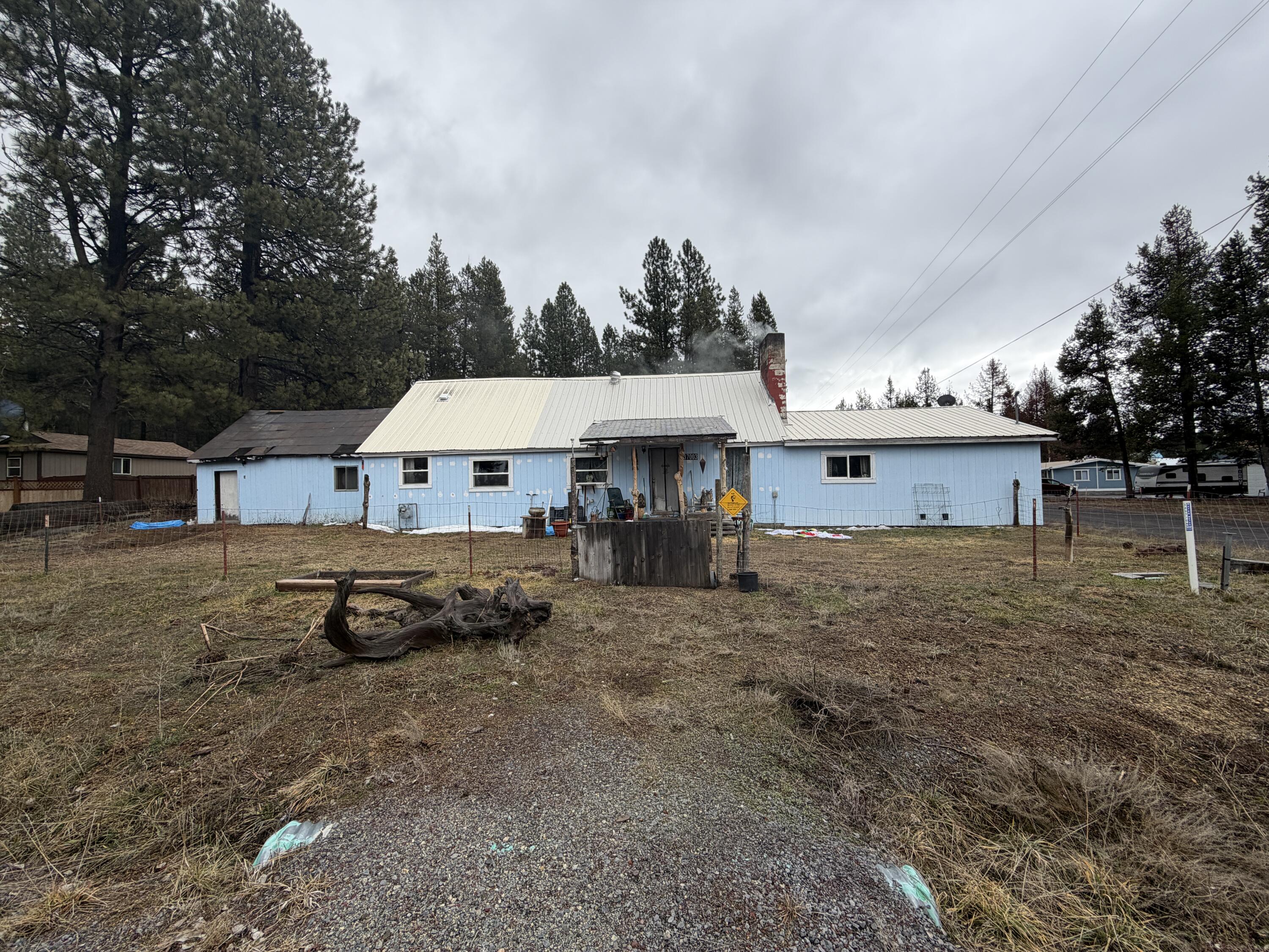 137003 Main Street Crescent, OR 97733 - Photo 3 of 19 a view of a house with a yard and sitting area