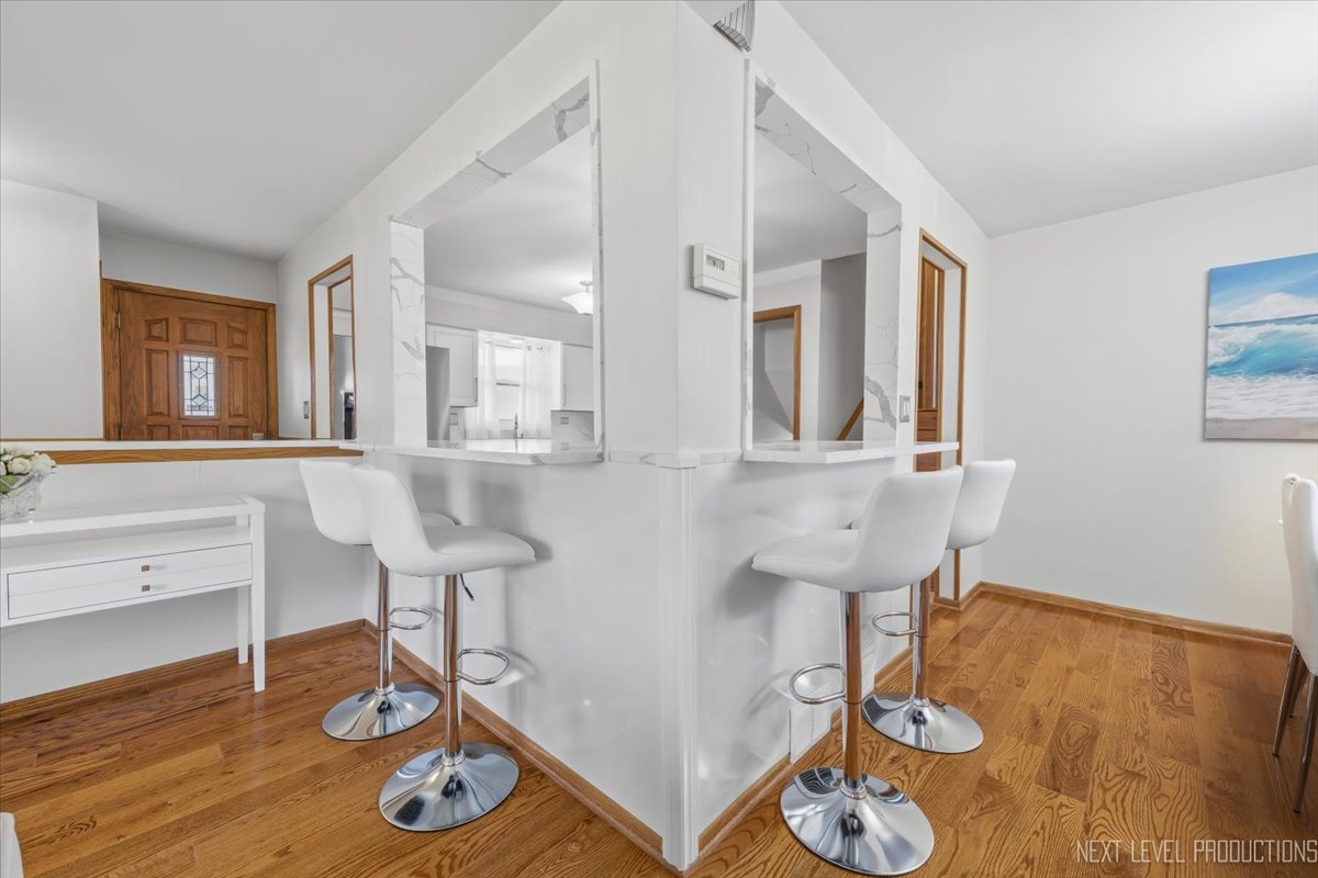 754 North Michigan Street Elmhurst, IL 60126 - Photo 10 of 32 a living room with furniture and a wooden floor