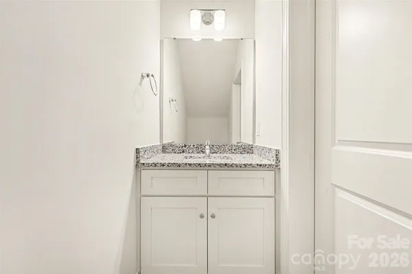 a room with a stove and a microwave