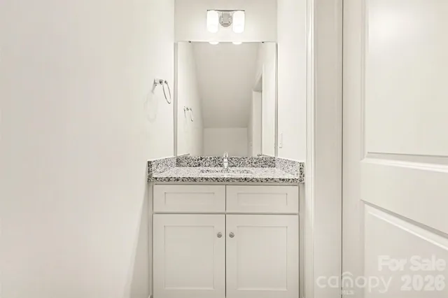 a room with a stove and a microwave