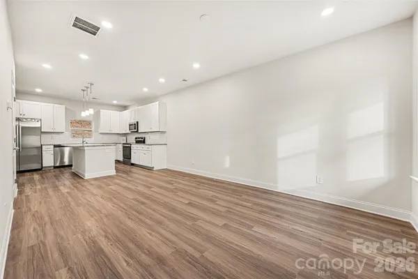 a view of kitchen with wooden floor