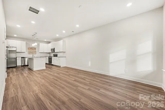 a view of kitchen with wooden floor