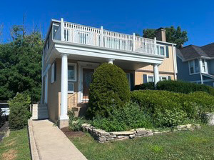 front view of a house with a yard