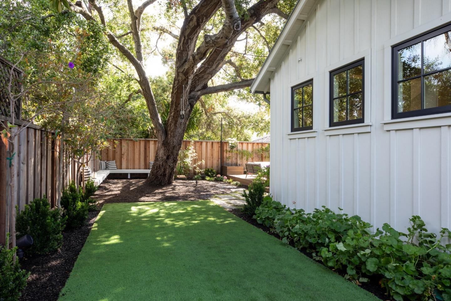993 Embarcadero Road Palo Alto, CA 94303 - Photo 23 of 24 a view of a backyard with a large tree