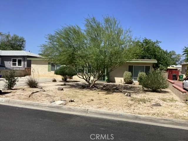 a view of a house with a snow in the yard