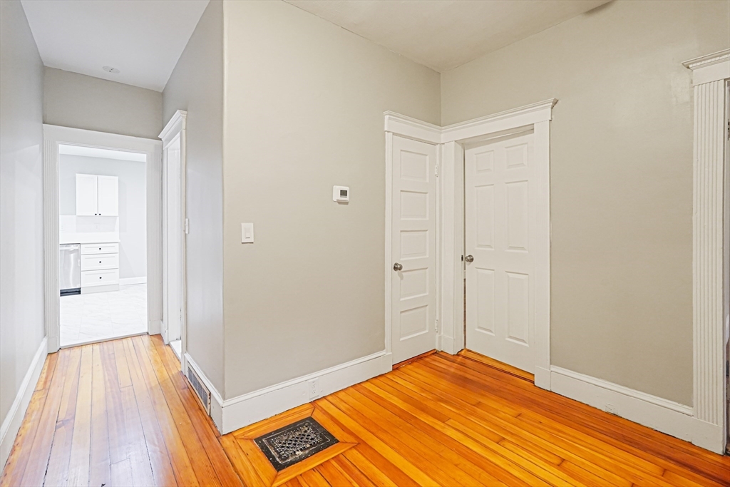 381 Adams Street, Unit 1 Boston, MA 02122 - Photo 20 of 42 a view of a room with wooden floor