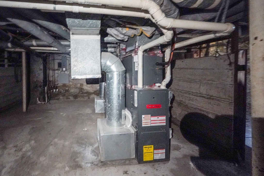 381 Adams Street, Unit 1 Boston, MA 02122 - Photo 25 of 42 a view of store room with washer and dryer
