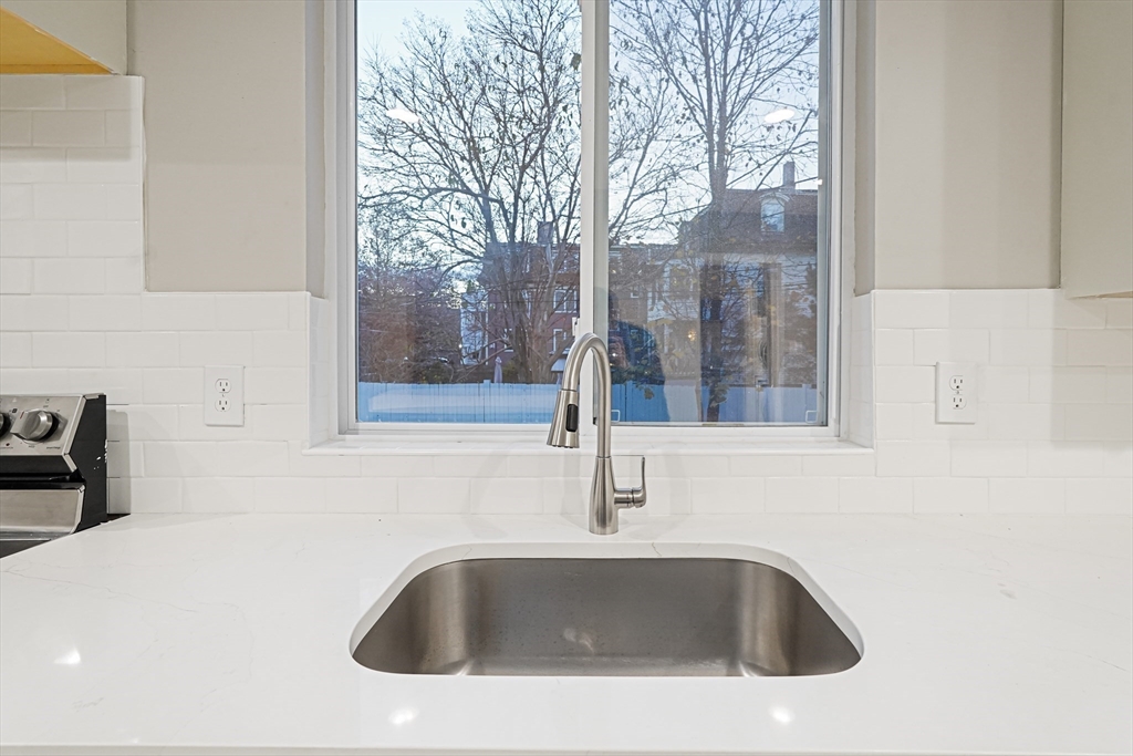 381 Adams Street, Unit 1 Boston, MA 02122 - Photo 4 of 42 a close view of sink and tap
