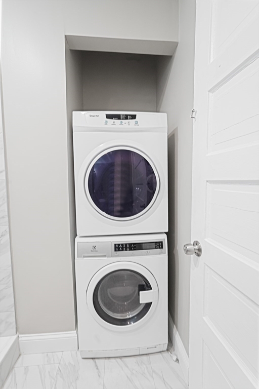 381 Adams Street, Unit 1 Boston, MA 02122 - Photo 8 of 42 a utility room with dryer and washer