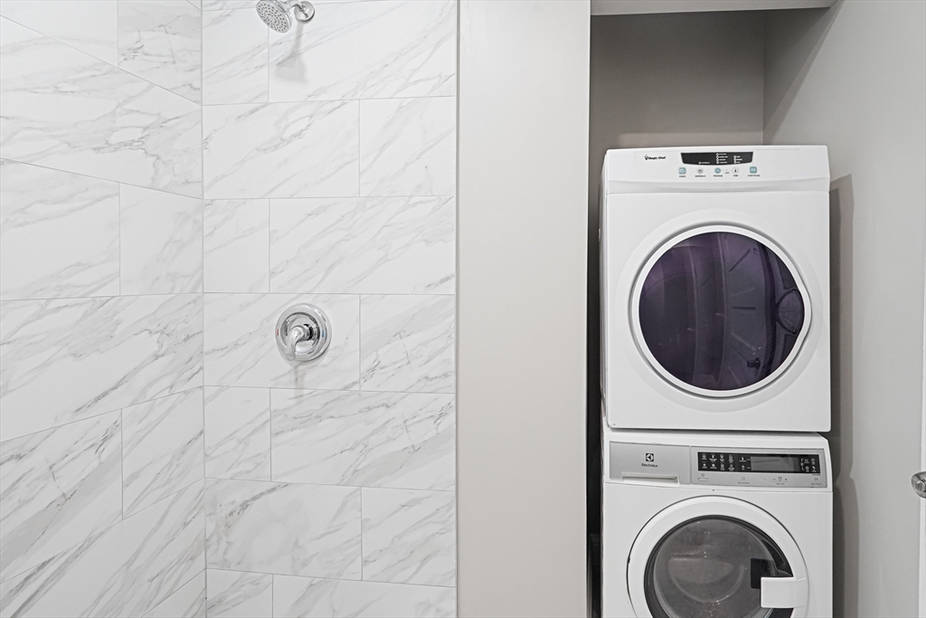 381 Adams Street, Unit 1 Boston, MA 02122 - Photo 9 of 42 a utility room with dryer and washer