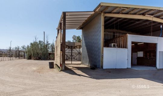 1652 Rademacher Way Ridgecrest, CA 93555 - Photo 15 of 16 a view of a house with a backyard