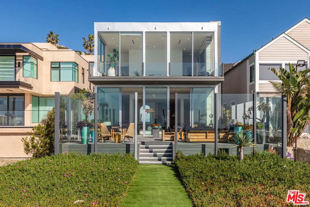 31220 Broad Beach Road Malibu, CA 90265 - Photo 11 of 33 front view of a building with a garden
