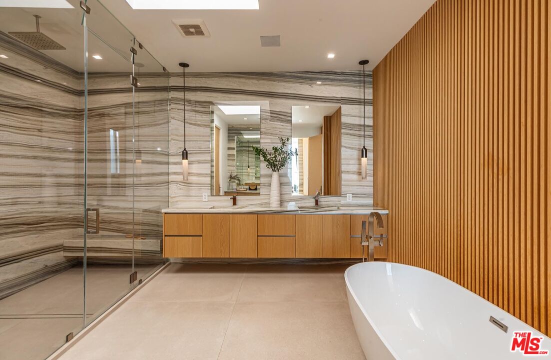 31220 Broad Beach Road Malibu, CA 90265 - Photo 15 of 33 a bathroom with a tub a sink and a large window