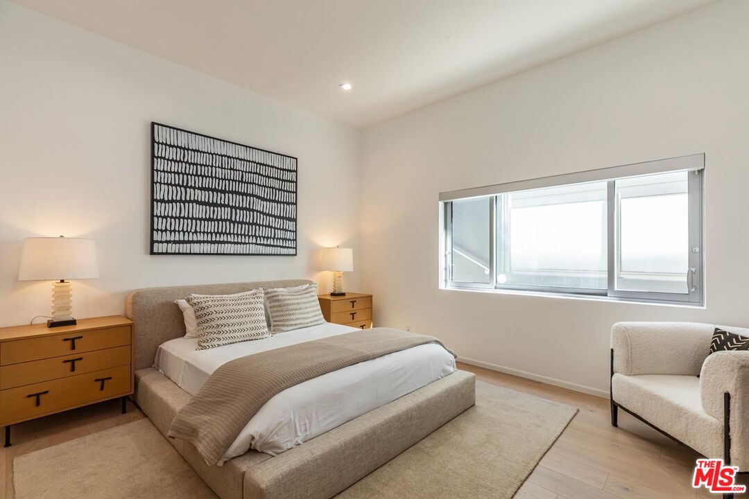 31220 Broad Beach Road Malibu, CA 90265 - Photo 17 of 33 a bedroom with a bed and a couch