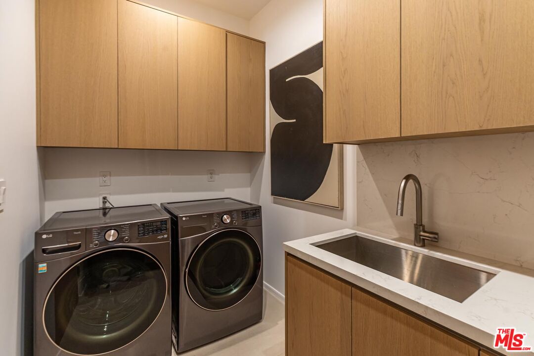 31220 Broad Beach Road Malibu, CA 90265 - Photo 18 of 33 a utility room with sink dryer and washer
