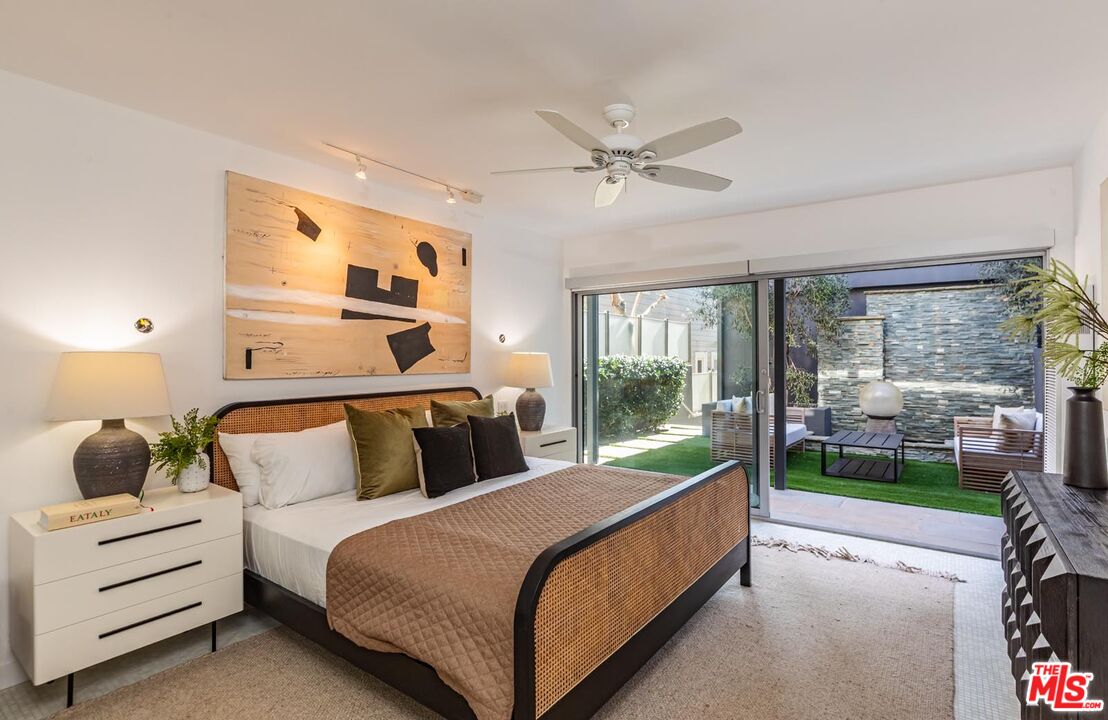 31220 Broad Beach Road Malibu, CA 90265 - Photo 22 of 33 a bedroom with a bed and large window