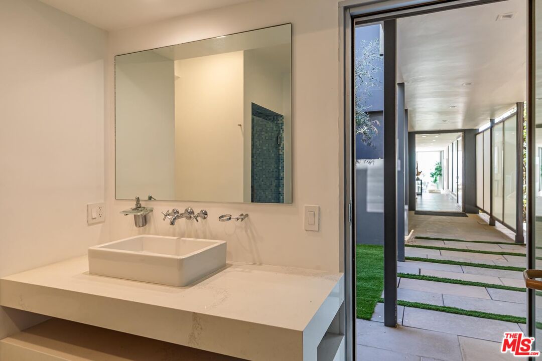 31220 Broad Beach Road Malibu, CA 90265 - Photo 23 of 33 a bathroom with a sink and a mirror