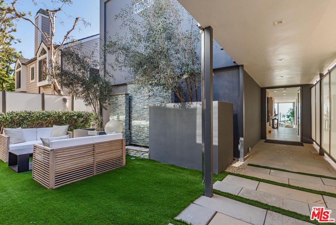 31220 Broad Beach Road Malibu, CA 90265 - Photo 24 of 33 a view of a couches in backyard of house