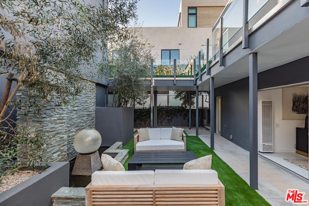 31220 Broad Beach Road Malibu, CA 90265 - Photo 25 of 33 a front view of a house with a garden