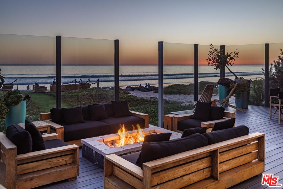 31220 Broad Beach Road Malibu, CA 90265 - Photo 29 of 33 a living room with furniture and floor to ceiling window
