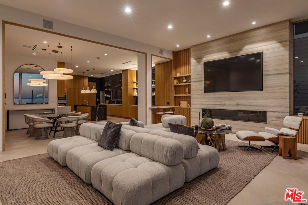 31220 Broad Beach Road Malibu, CA 90265 - Photo 32 of 33 a living room with furniture and a flat screen tv