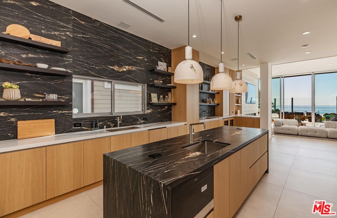 31220 Broad Beach Road Malibu, CA 90265 - Photo 8 of 33 a kitchen with stainless steel appliances granite countertop a sink a stove and a wooden floors
