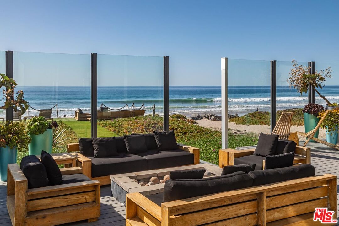 31220 Broad Beach Road Malibu, CA 90265 - Photo 10 of 33 a living room with furniture and floor to ceiling window