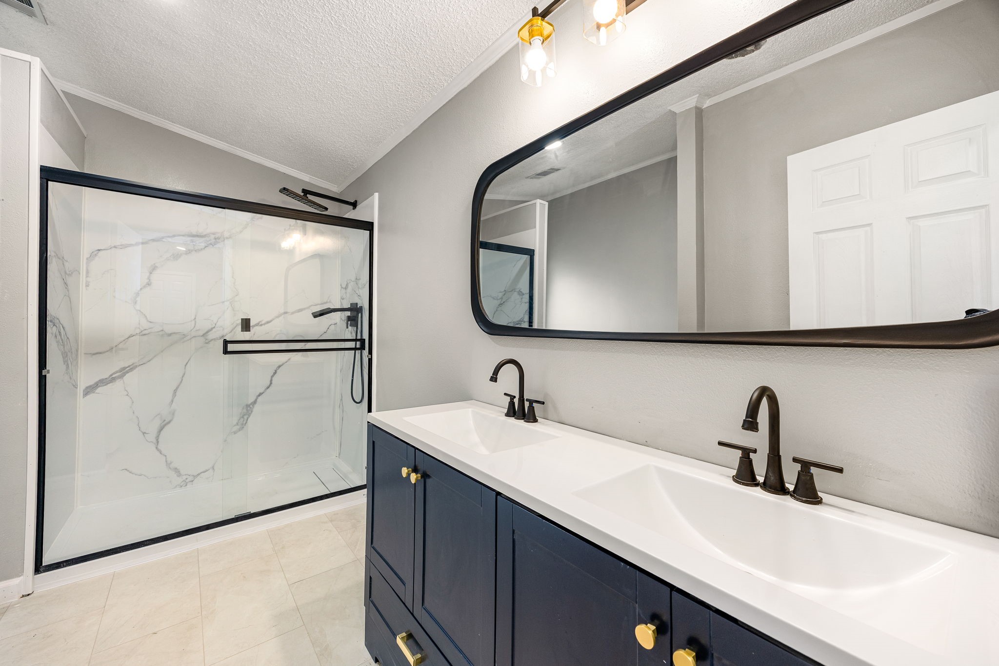 14262 Shadow Bay Drive Willis, TX 77318 - Photo 13 of 26 a bathroom with a sink and a mirror