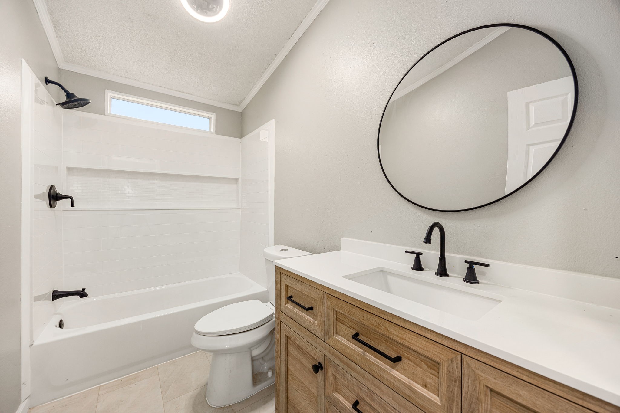 14262 Shadow Bay Drive Willis, TX 77318 - Photo 16 of 26 a bathroom with a sink a toilet and a mirror