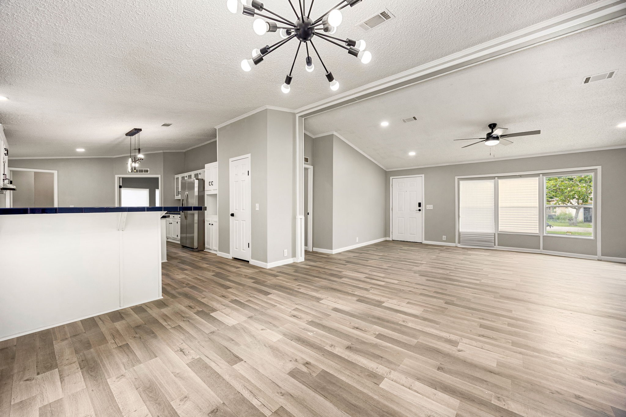 14262 Shadow Bay Drive Willis, TX 77318 - Photo 3 of 26 a view of an empty room with wooden floor and a window