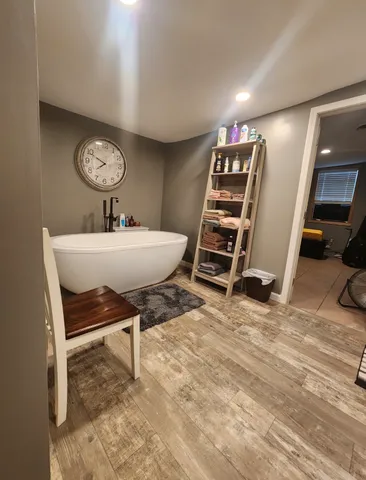 a view of a house with a yard and parking space