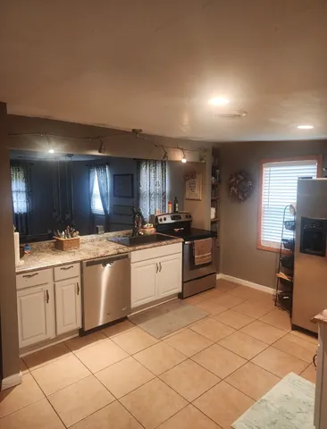 a view of a chairs and tables in patio