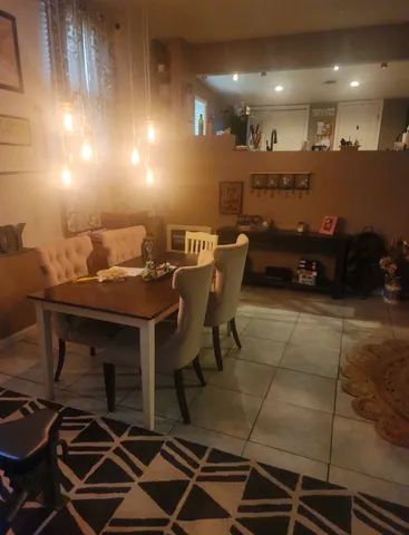 a living room with lots of furniture and gym equipment