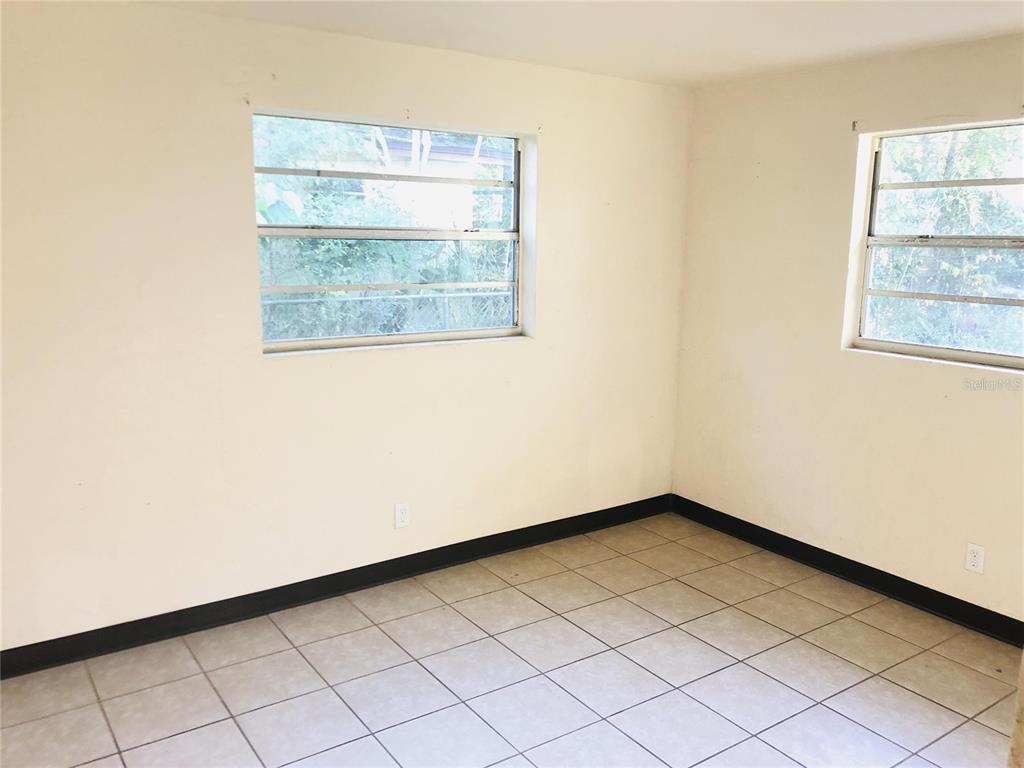 1584 Primrose Lane Daytona Beach, FL 32117 - Photo 2 of 8 an empty room with a window
