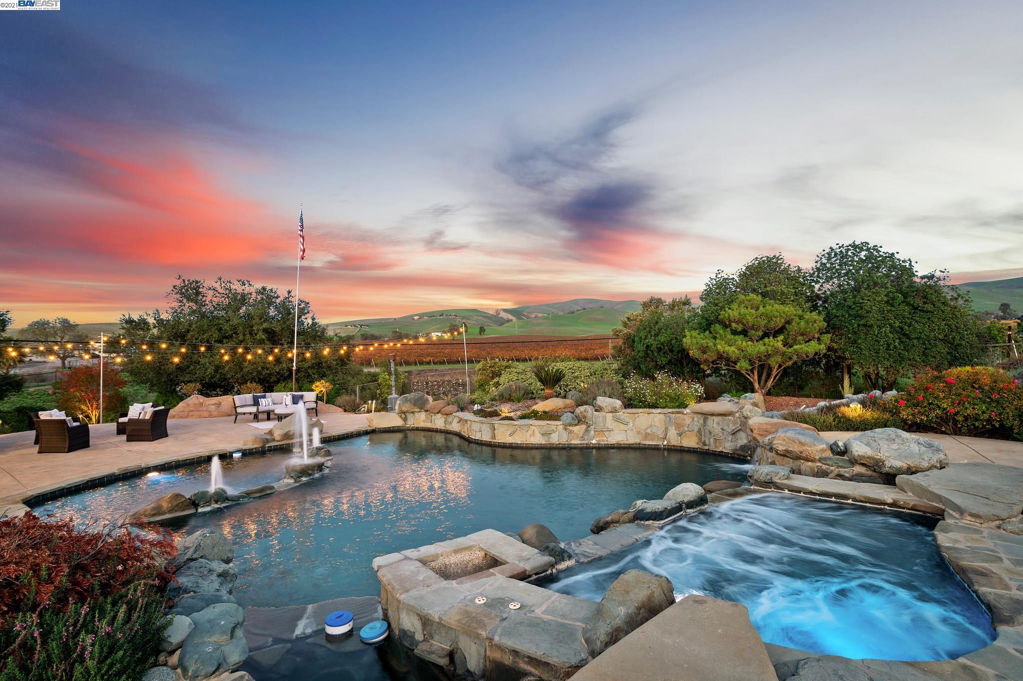 an aerial view of a house with lake view